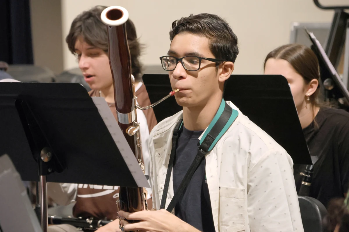 A young bassoonist rehearsing alongside fellow Symphony Youth Orchestra musicians