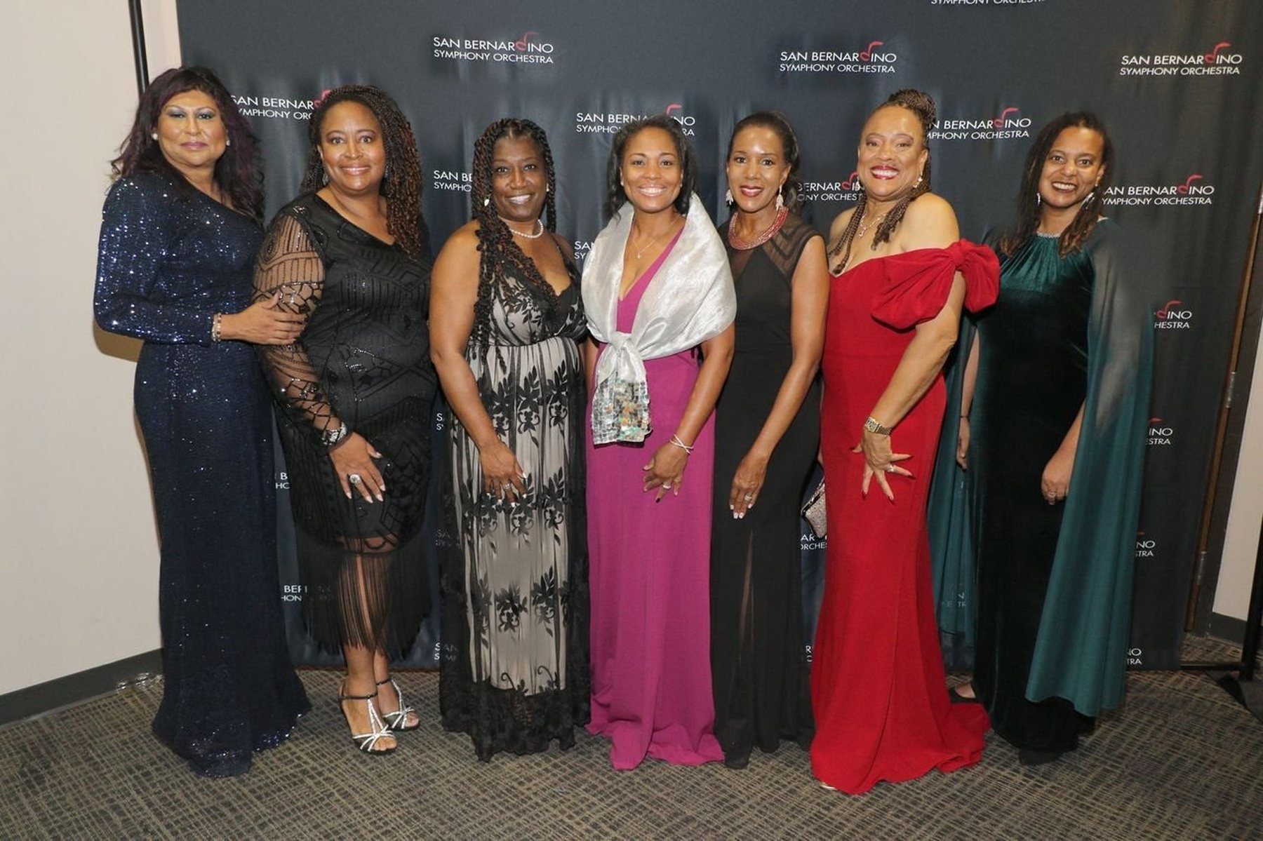 Evening gowns before the Symphony backdrop